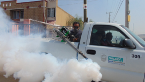 a person fumigating the street