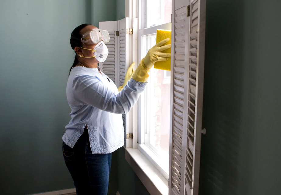 woman cleaning window